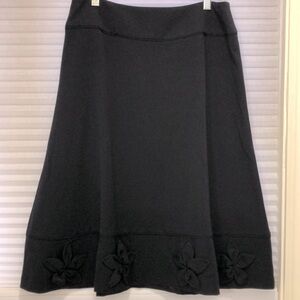 East 5th ladies black skirt with flower appliqués. Size 12